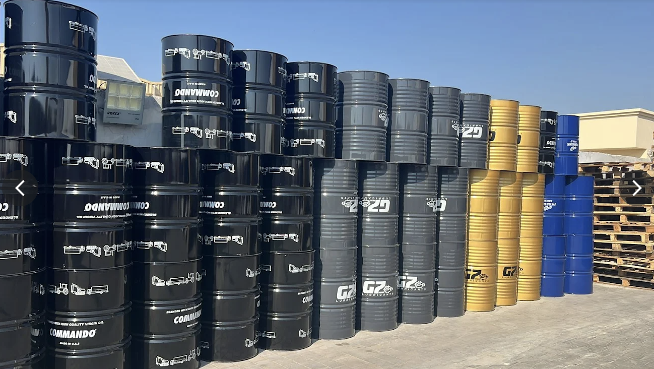 Stacked Premier Lubricants drums ready for export